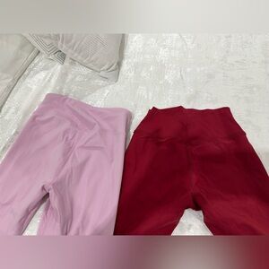 Two pairs of new women's leggings, size M but they fit more like a size S.